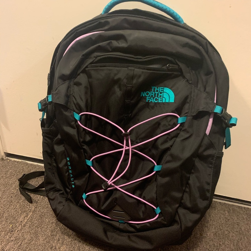 Black ,teal and purple north face backpack